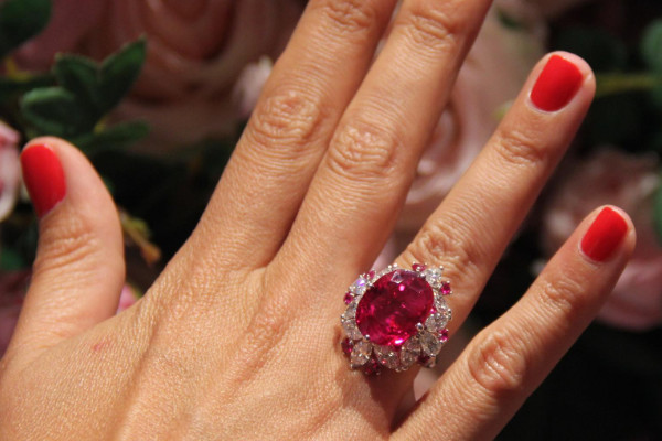 someone wearing a ruby ring
